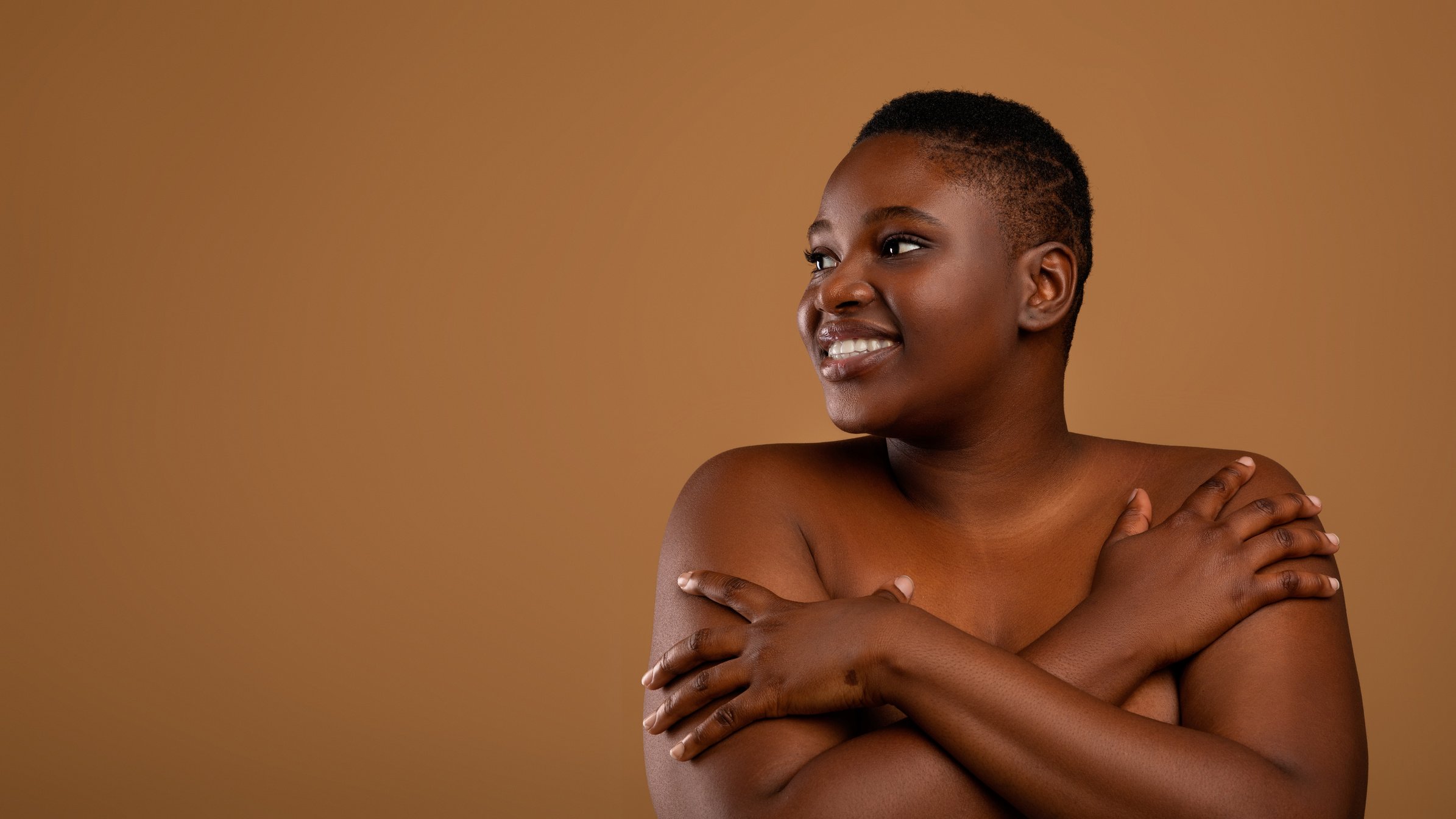 Beautiful plus Size African American Woman Embracing Herself